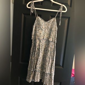 Greenish Gray sundress with with flower detailing.